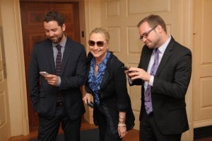 Hillary Clinton posing with the creators of the texts from Hillary tmblr