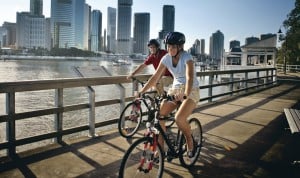 Brisbane - cyclists on the floating pathway along Brisbane River